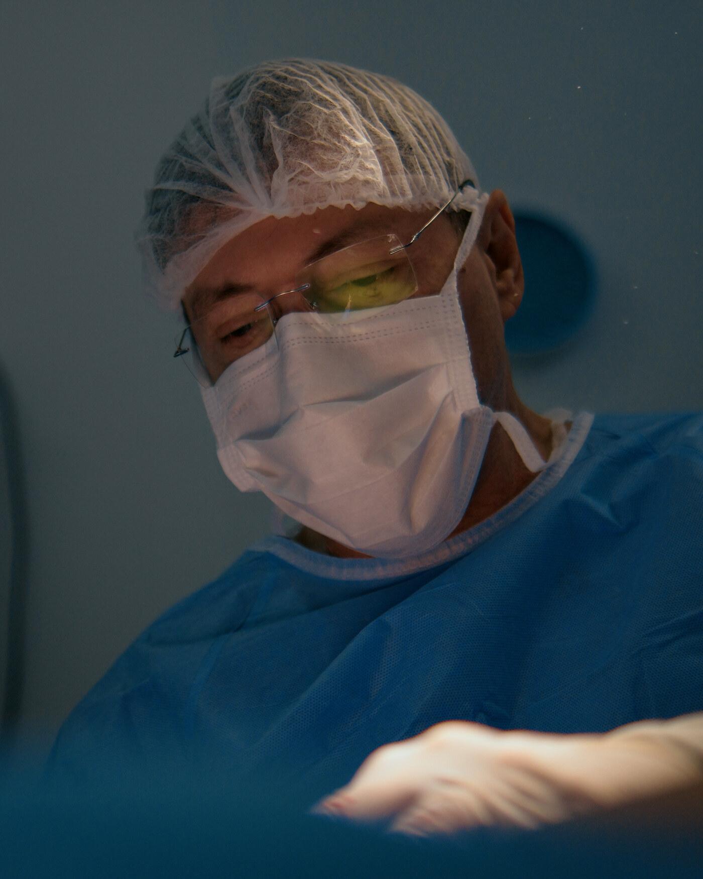 Dr. Nasser Mahfouz in surgical attire in the operating room